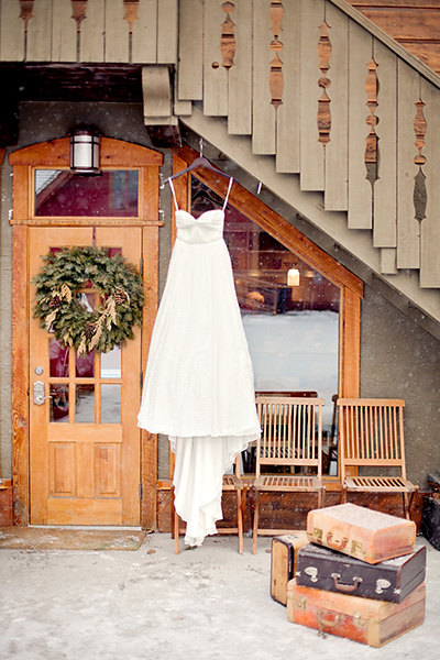 Wedding dress with vintage suitcases as props :: Canmore Wedding Photography by infusedstudios.ca