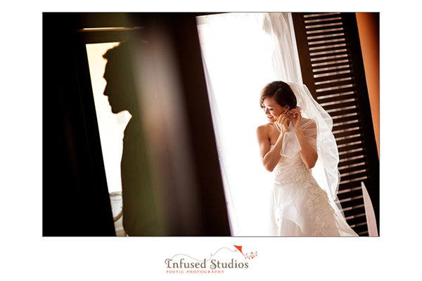 Focus on bride, groom in silhouette